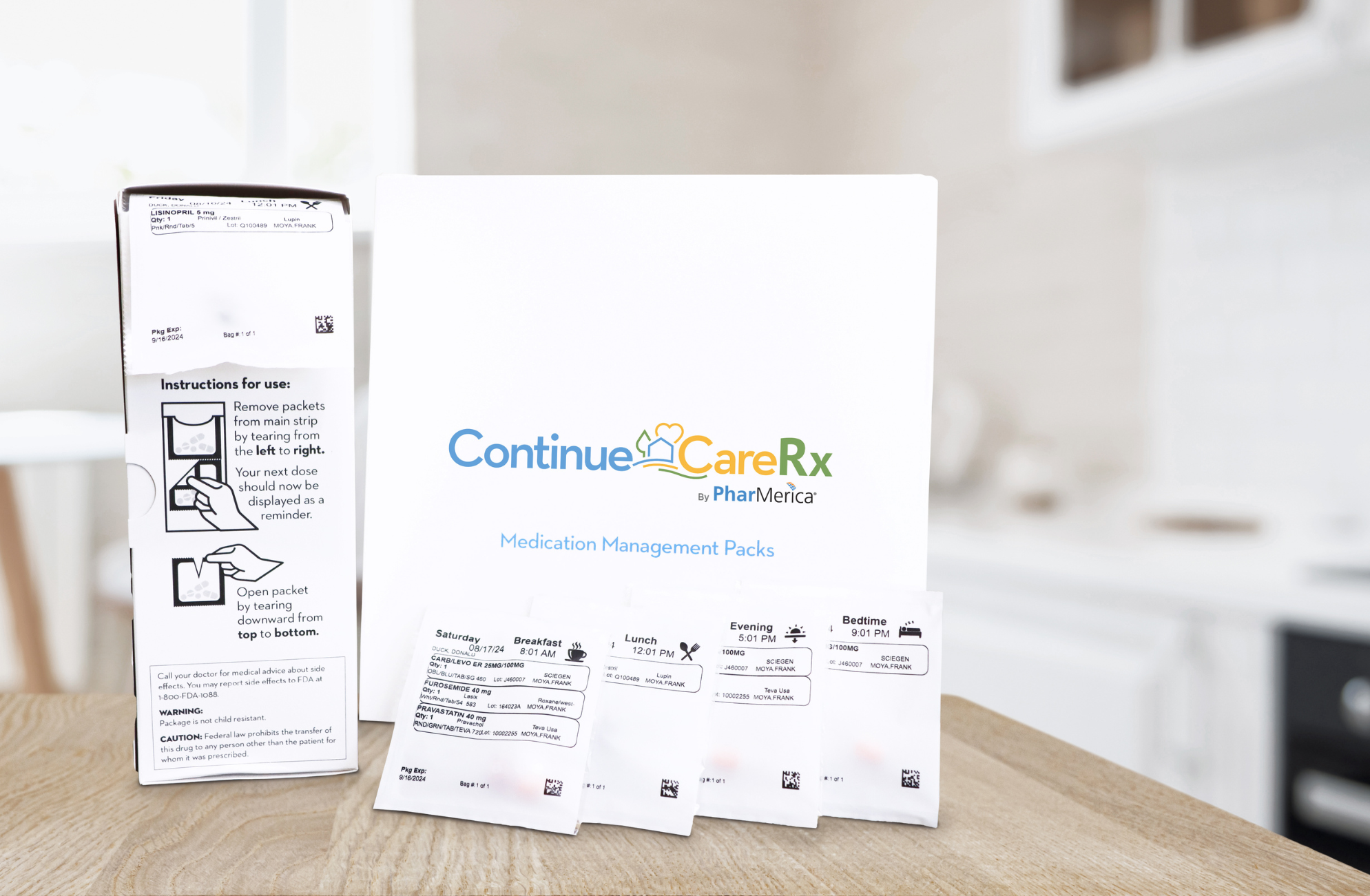 White Continue Care Rx medication management box on a wooden surface in a kitchen.